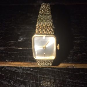 Bulova woman’s gold tone P4 watch